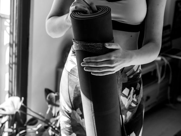Person holding a challenging yoga pose with focus and strength.